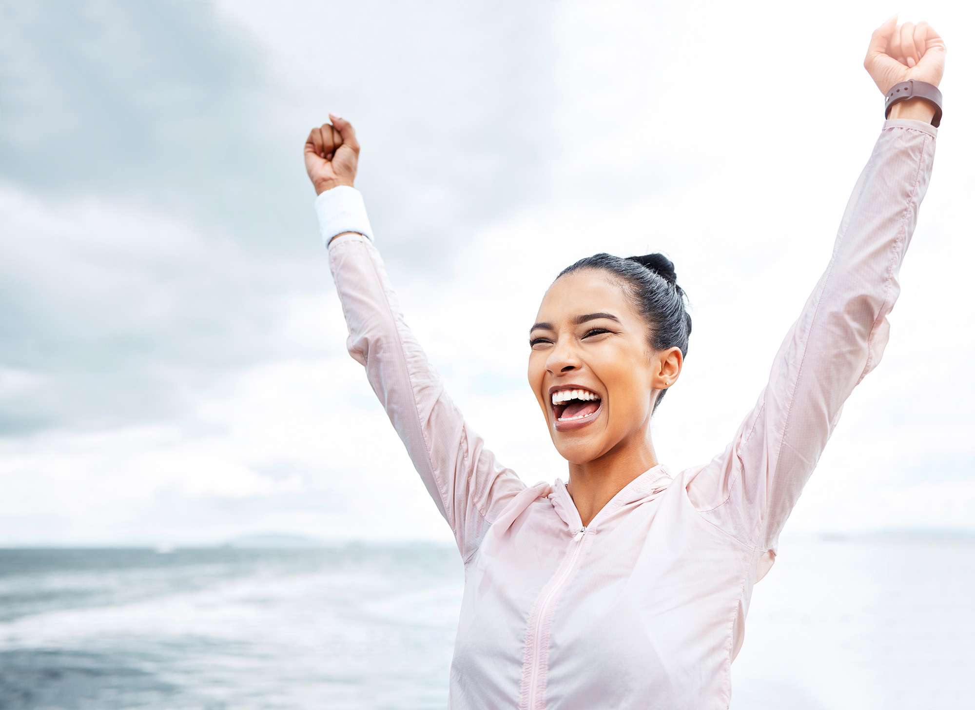 Diagnostic Endoscopy for GERD Evaluation General Reflux, & Bariatrics Surgeon Miami An image of a woman raising her arms and smiling which is paired with a blog on Diagnostic Endoscopy for GERD Evaluation