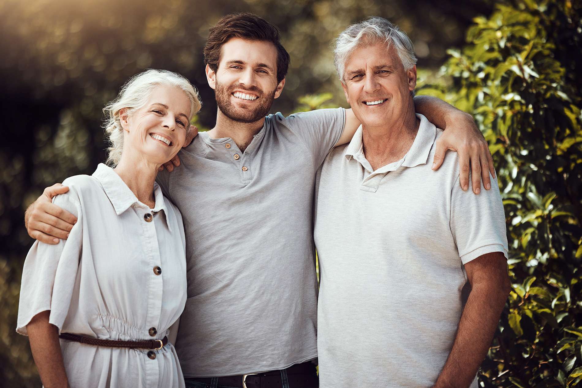 An image of three people, two appear to be senior parents and the son in the middle, paired with a blog post on Hernias.